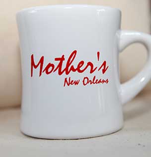 white mug with Mother's New Orleans' red print